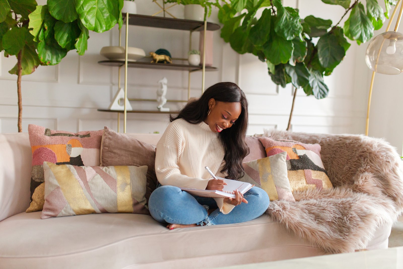 Victoria journaling on the sofa